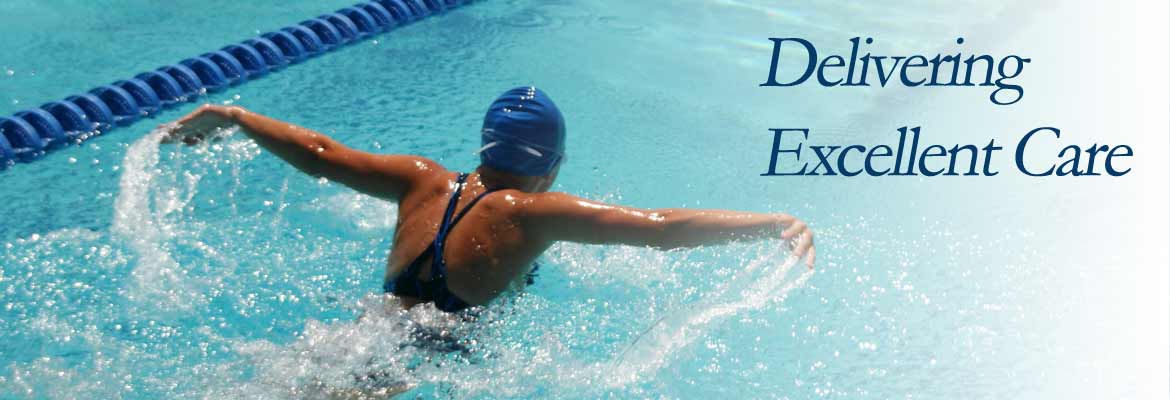 A person swimming in a pool. The words 